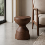Sculpted Wood Side Stool in a warm modern interior