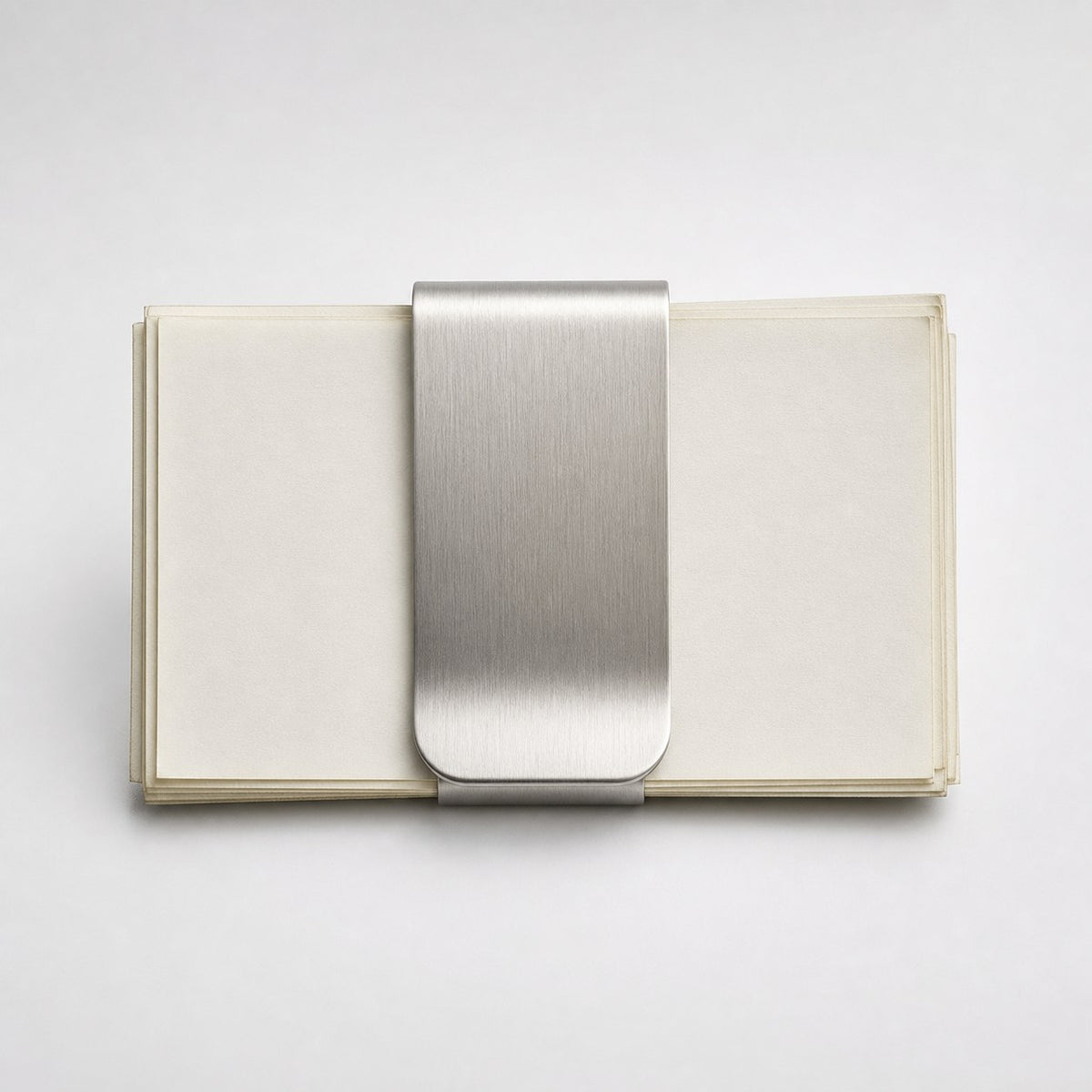 Solid Stainless Money Clip on a clean neutral background